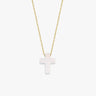 Minimalist studio view of a 14K solid gold necklace with a polished white opal cross pendant, centered on white.