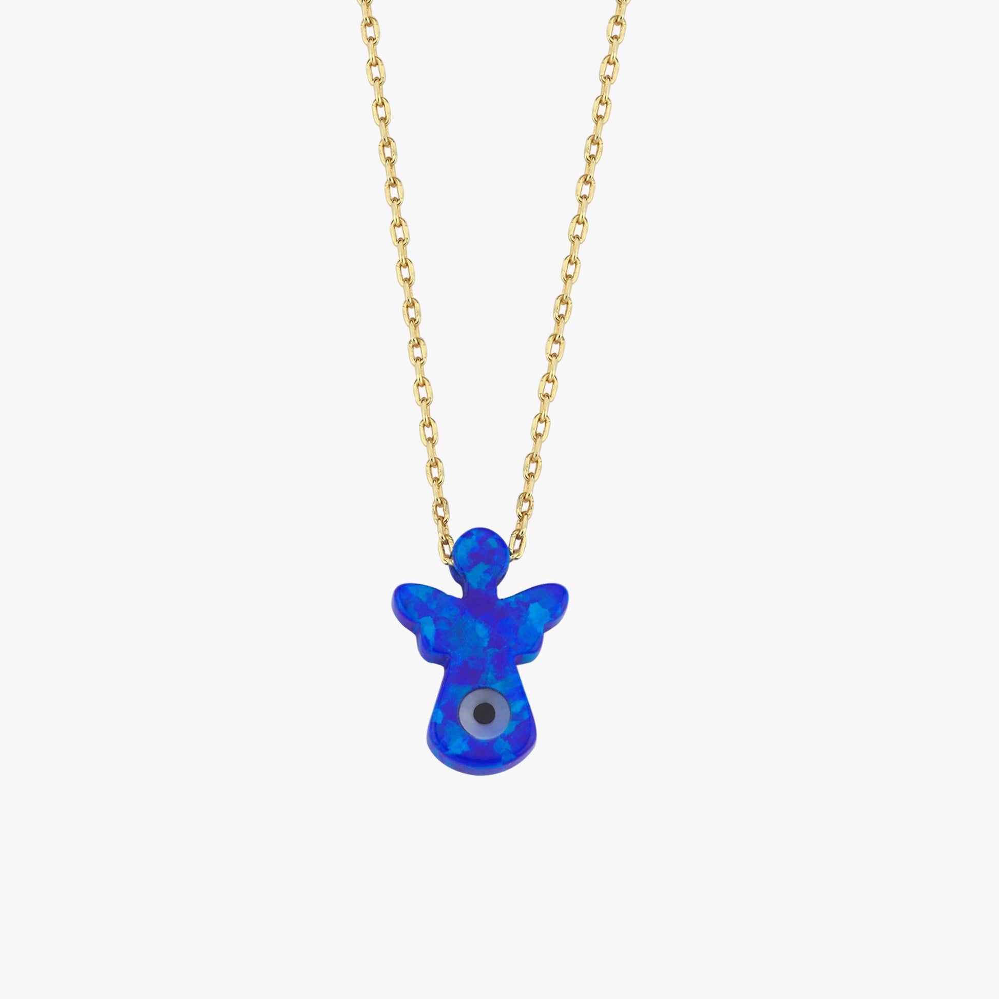 The 14K solid gold lucky symbol necklace with blue evil eye pendant rests on beige fabric, capturing its refined craftsmanship.