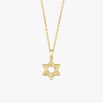 Close-up of 14K Solid Gold Magen David Necklace on collarbone.