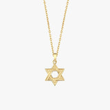 Close-up of 14K Solid Gold Magen David Necklace on collarbone.