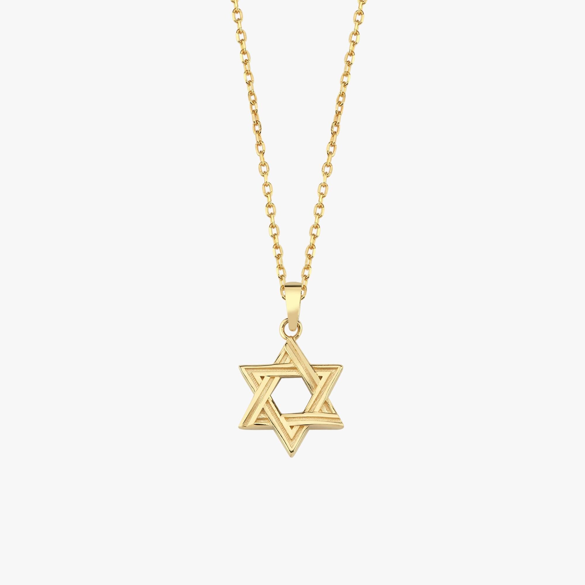 Close-up of 14K Solid Gold Magen David Necklace on collarbone.