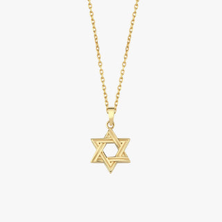 Close-up of 14K Solid Gold Magen David Necklace on collarbone.