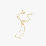 Flat lay of the 18K gold vermeil hand chain on a white background, showing its intricate design and multiple connecting strands.