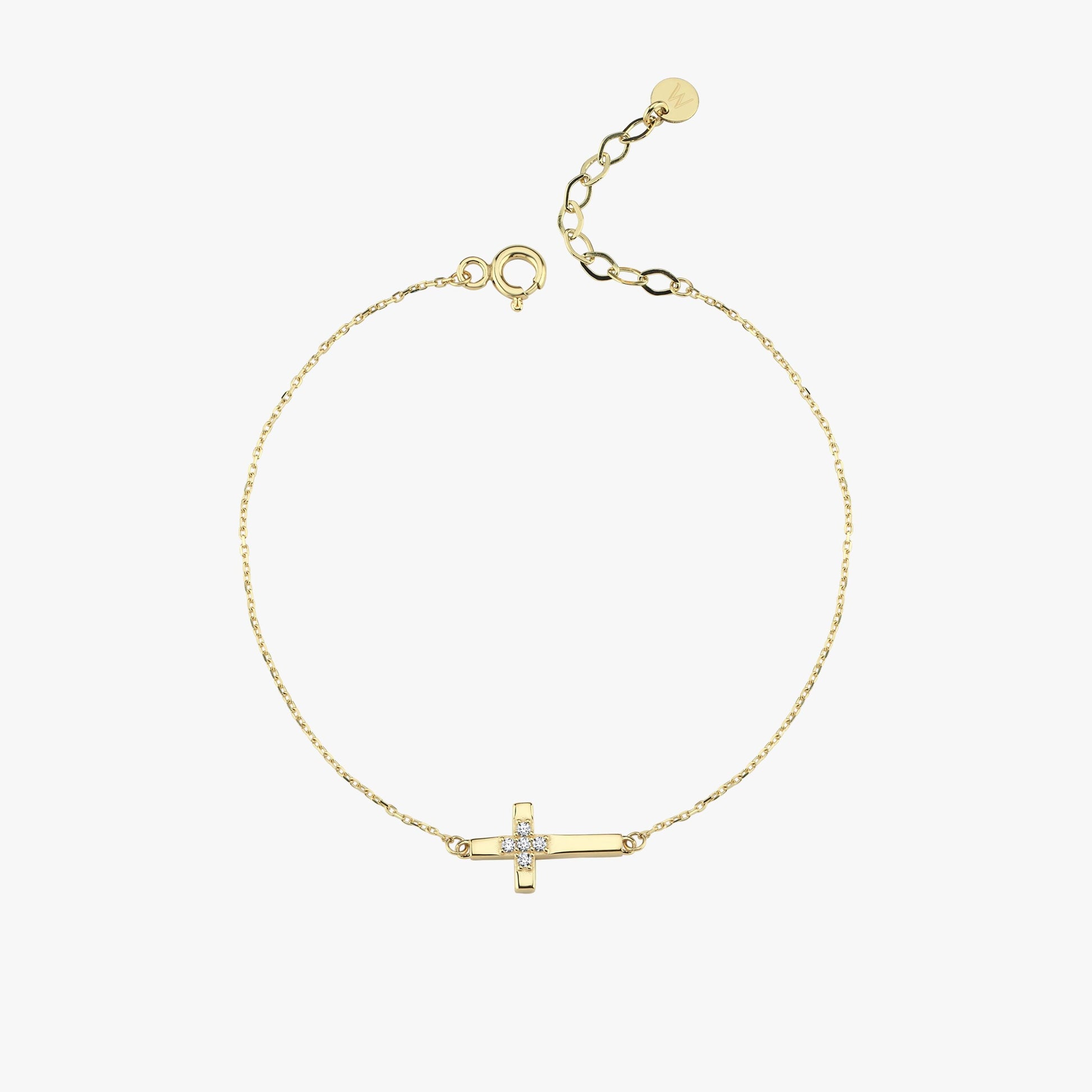 Flat-lay image of a 14K solid gold cross bracelet for women, featuring a delicate chain and diamond-detailed cross charm.