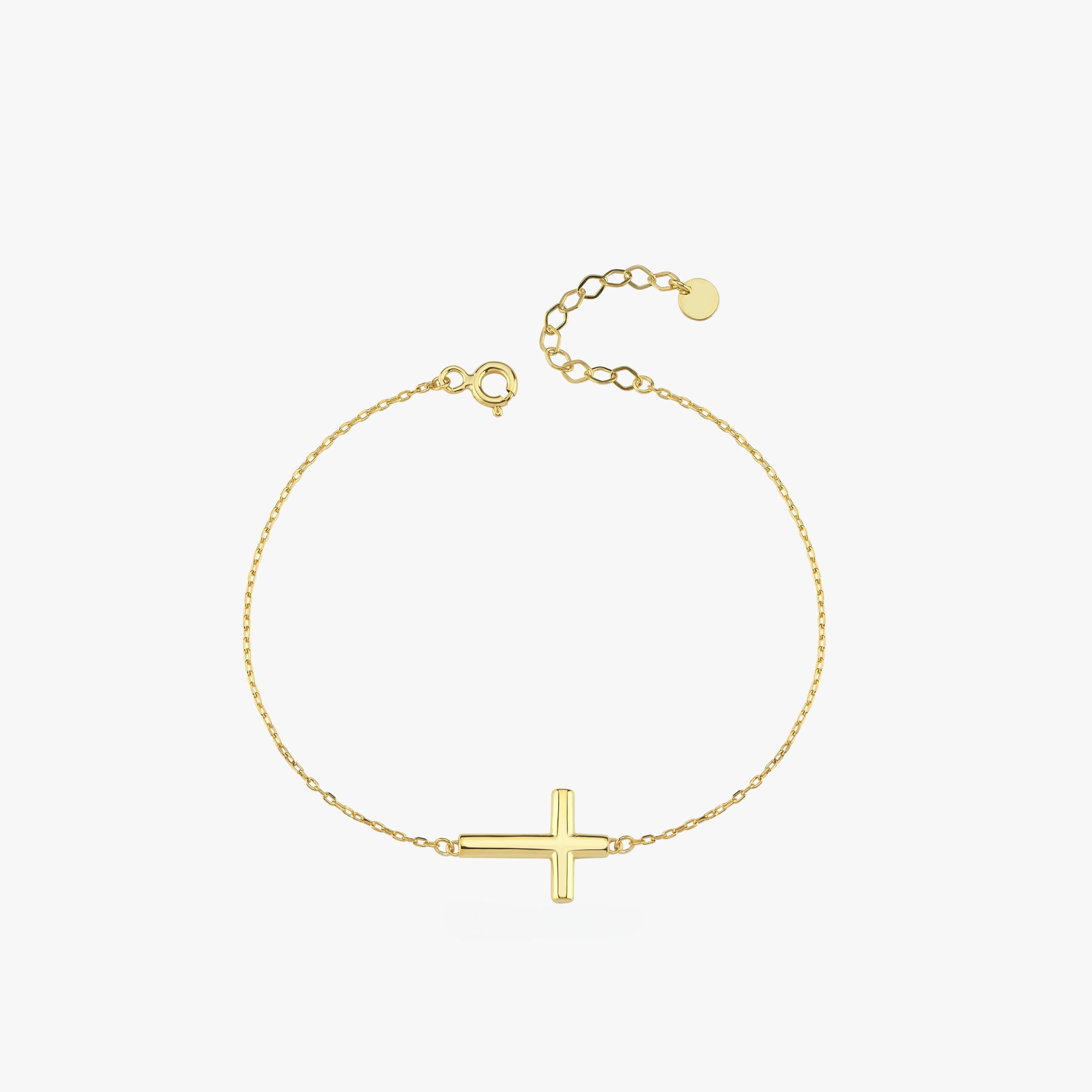 Top view of a 14K solid gold dainty cross bracelet with a thick horizontal cross, displayed in a loop on a white background.
