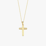 Front-facing product image of a 14K solid gold cross necklace with a polished finish and fine link chain.