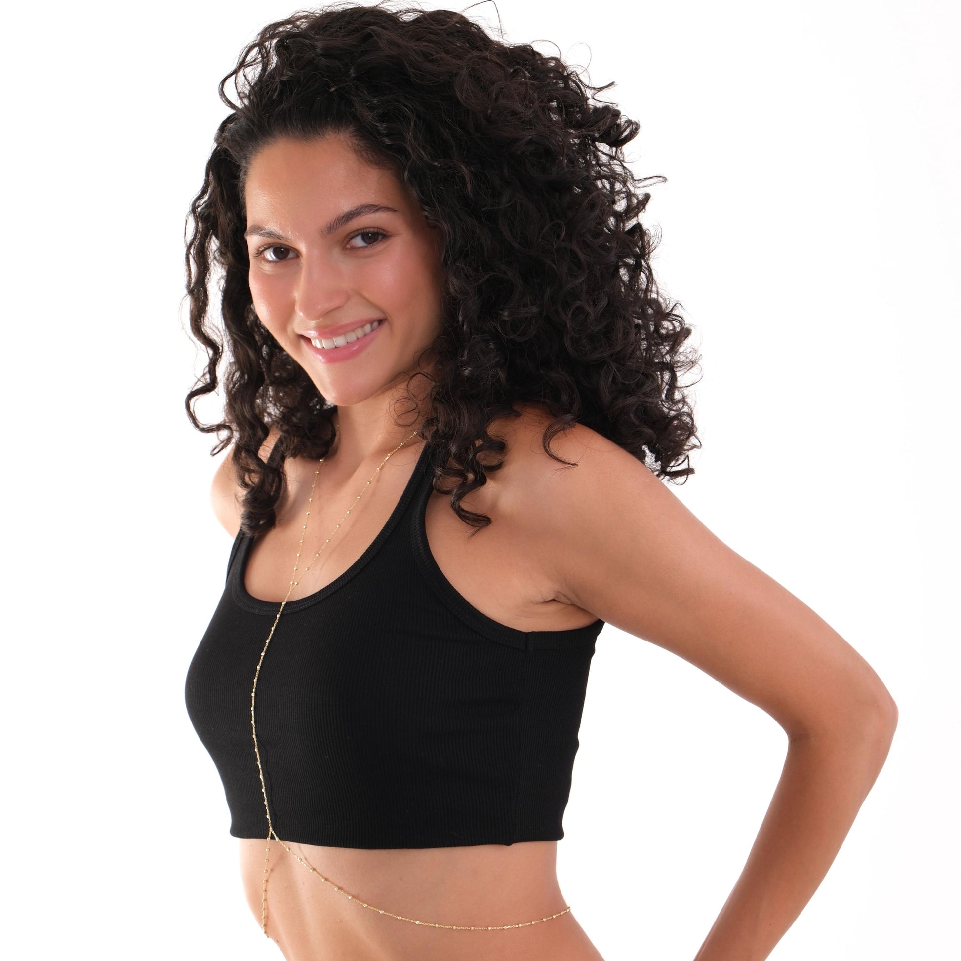 Smiling model posing with the 18K Gold Vermeil Beaded Body Chain wrapped around her waist.