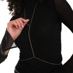 Close-up of 18K Gold Vermeil Bar and Bead Body Jewelry styled over a sheer black top.