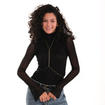 Styled over a high-neck black shirt and jeans, the 18K Gold Vermeil Body Chain Jewelry adds a subtle shine to the outfit.