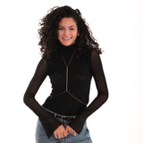 Styled over a high-neck black shirt and jeans, the 18K Gold Vermeil Body Chain Jewelry adds a subtle shine to the outfit.