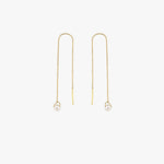 Pair of 14K Solid Gold Threader Earrings with Real Pearl displayed hanging evenly.