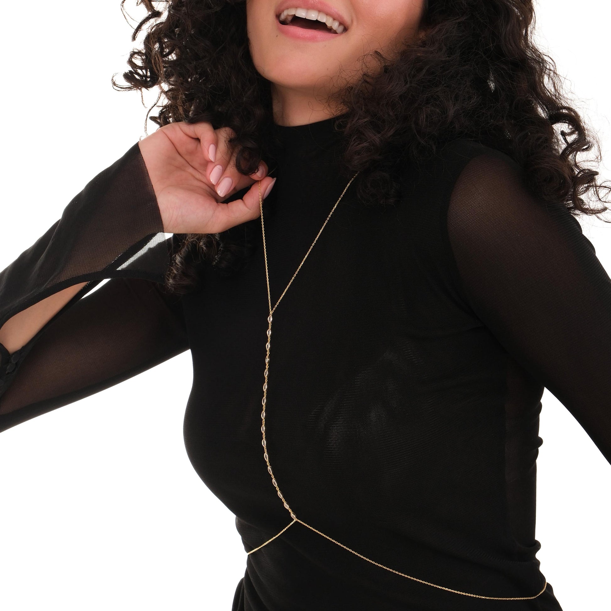 A woman wears a delicate 18K Gold Vermeil Body Chain Jewelry over a fitted black top.