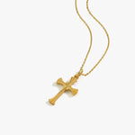 Flat-lay of the 18K Gold Vermeil Cross Necklace, showcasing the polished cross pendant on a delicate gold chain.