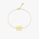 Circularly laid 14K solid gold Kids Handwriting Bracelet showing the engraved child-like illustration and text.