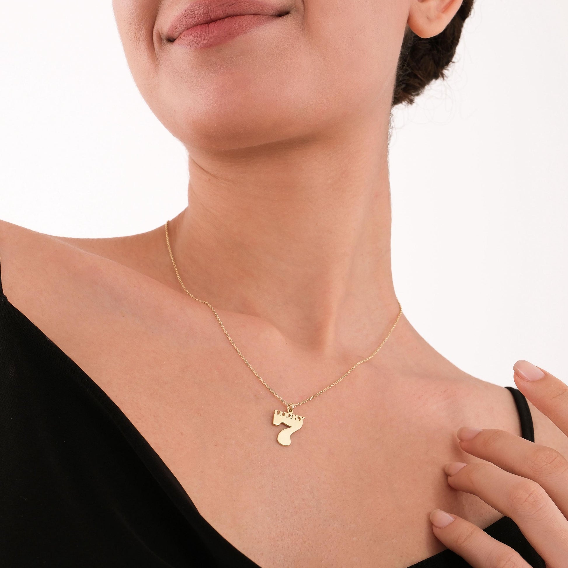The Lucky 7 necklace adds subtle shine and symbolic charm to everyday outfits.
