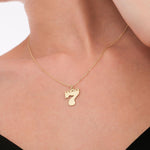 The gold Lucky Seven pendant catches the light beautifully against the skin.
