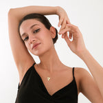 The dainty Lucky 7 charm necklace offers a touch of good fortune in solid gold.