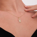 A graceful touch highlights the polished boy name pendant in solid gold.