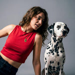 Woman posing with her dog wearing an 18K Gold Vermeil Pet Photo Necklace with a personalized pet image engraving.