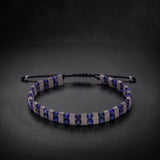 Men's lapis lazuli and hematite natural stone bracelet on an adjustable cord