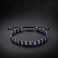 Men's lapis lazuli and hematite natural stone bracelet on an adjustable cord