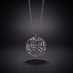 Men's mechanical gear necklace in sterling silver, a round steampunk gear pendant on a ball chain