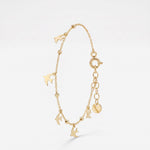 Gold dove bracelet with dangling dove charms and gold beads, a memorial remembrance bracelet in 14K solid gold