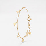 Gold dove bracelet with dangling dove charms and gold beads, a memorial remembrance bracelet in 14K solid gold
