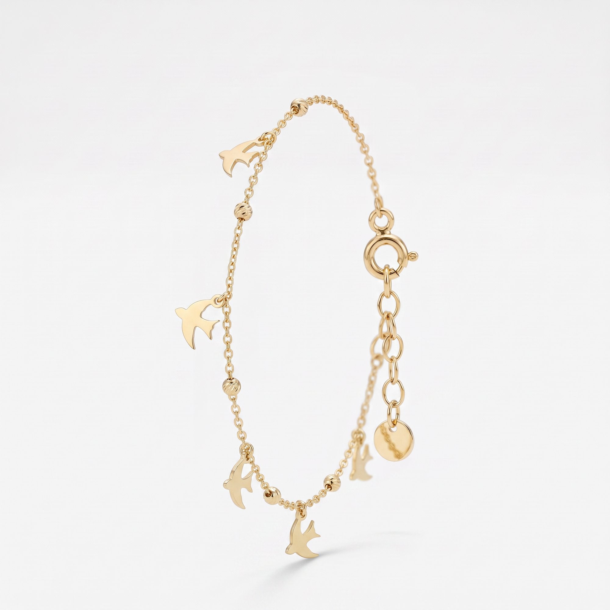 Gold dove bracelet with dangling dove charms and gold beads, a memorial remembrance bracelet in 14K solid gold