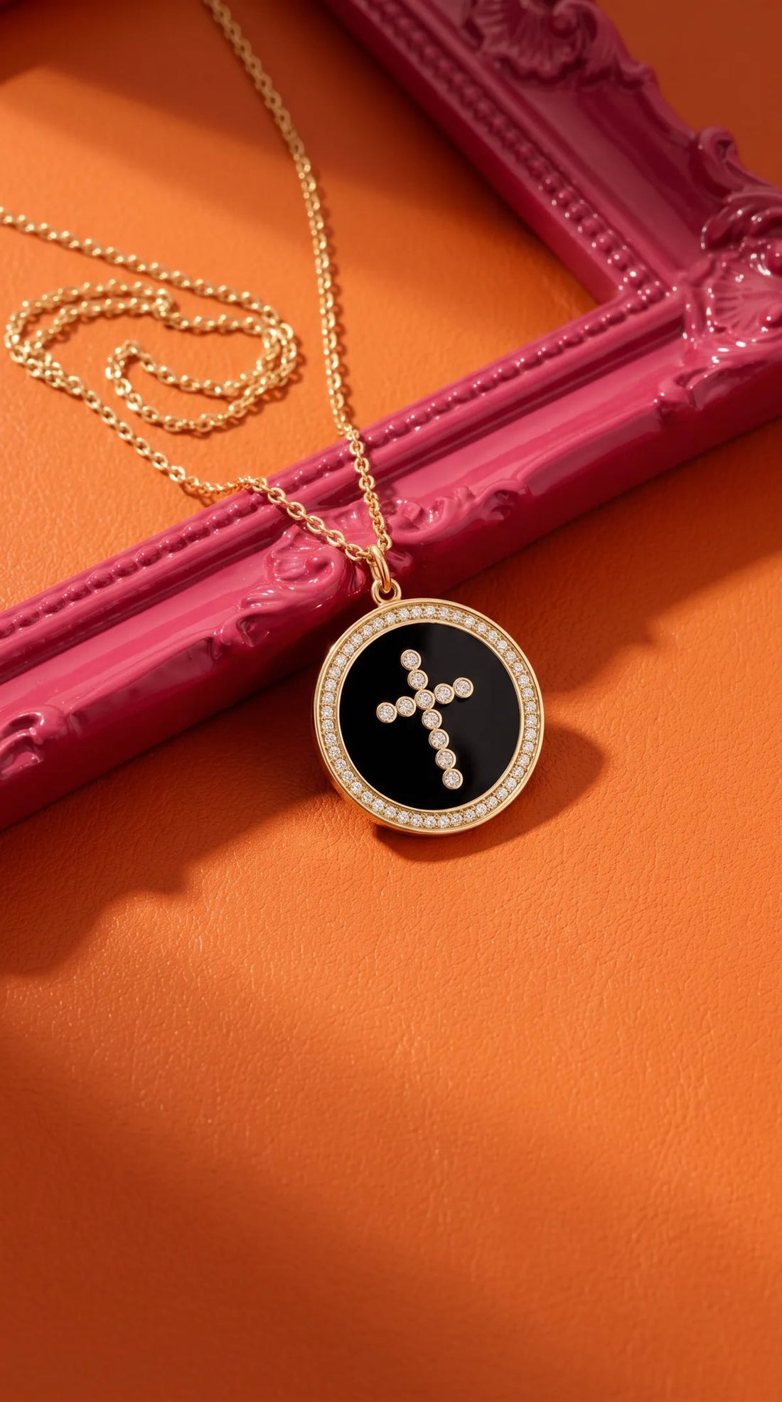 Cross coin necklace on a pink frame