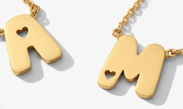 Gold bubble initial necklaces A and M