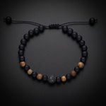 Men's natural stone bracelet with matte onyx, tiger's eye and a pavé bead on an adjustable cord
