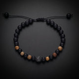 Men's natural stone bracelet with matte onyx, tiger's eye and a pavé bead on an adjustable cord