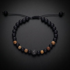 Men's natural stone bracelet with matte onyx, tiger's eye and a pavé bead on an adjustable cord