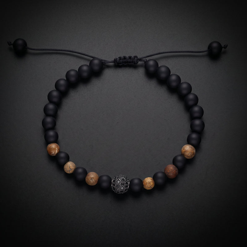 Men's natural stone bracelet with matte onyx, tiger's eye and a pavé bead on an adjustable cord