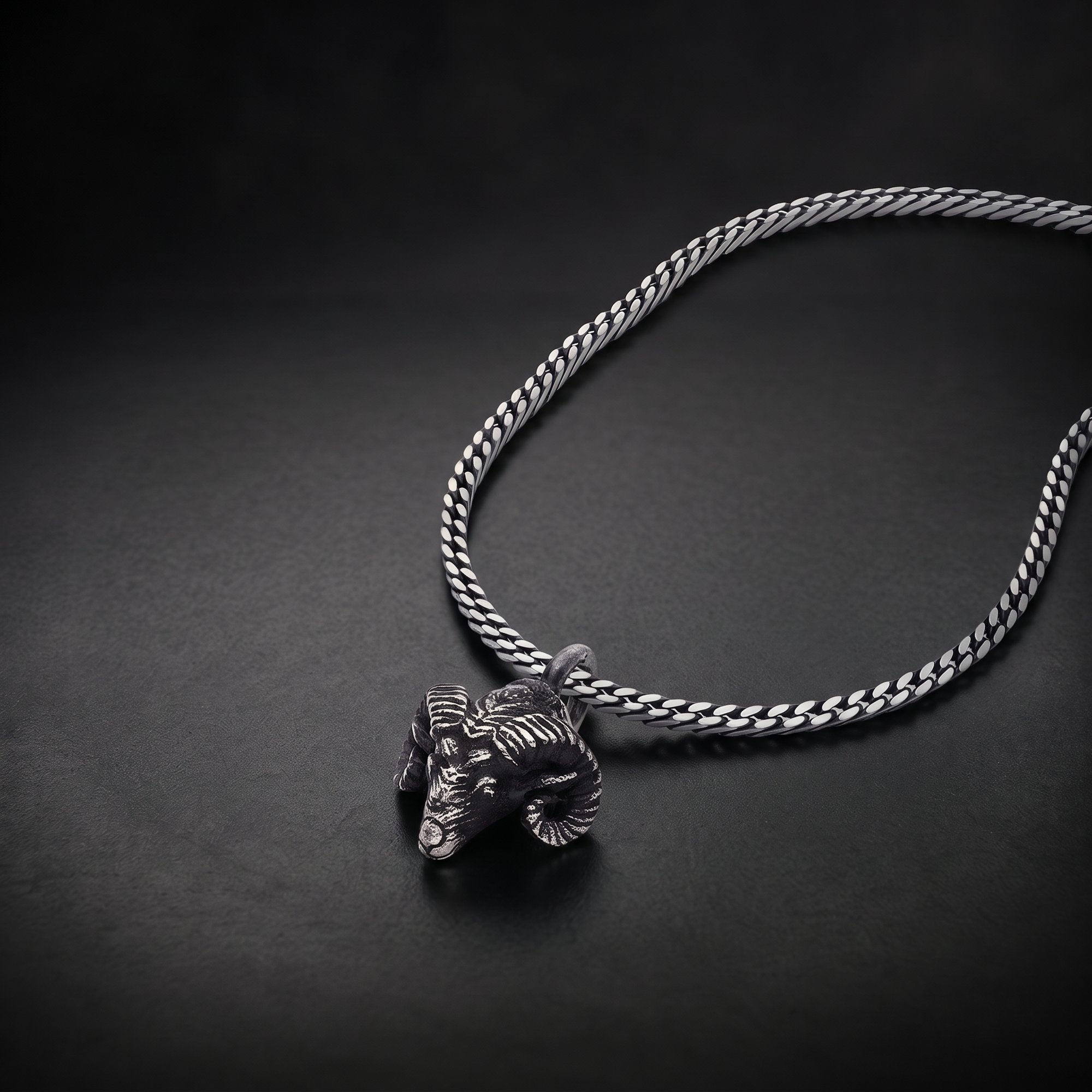 Men's ram head pendant necklace in oxidized 925 silver on a curb chain