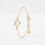 Gold sea turtle bracelet in 18K gold vermeil, an open turtle outline with a single clear stone on a dainty cable chain