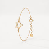 Gold sea turtle bracelet in 18K gold vermeil, an open turtle outline with a single clear stone on a dainty cable chain