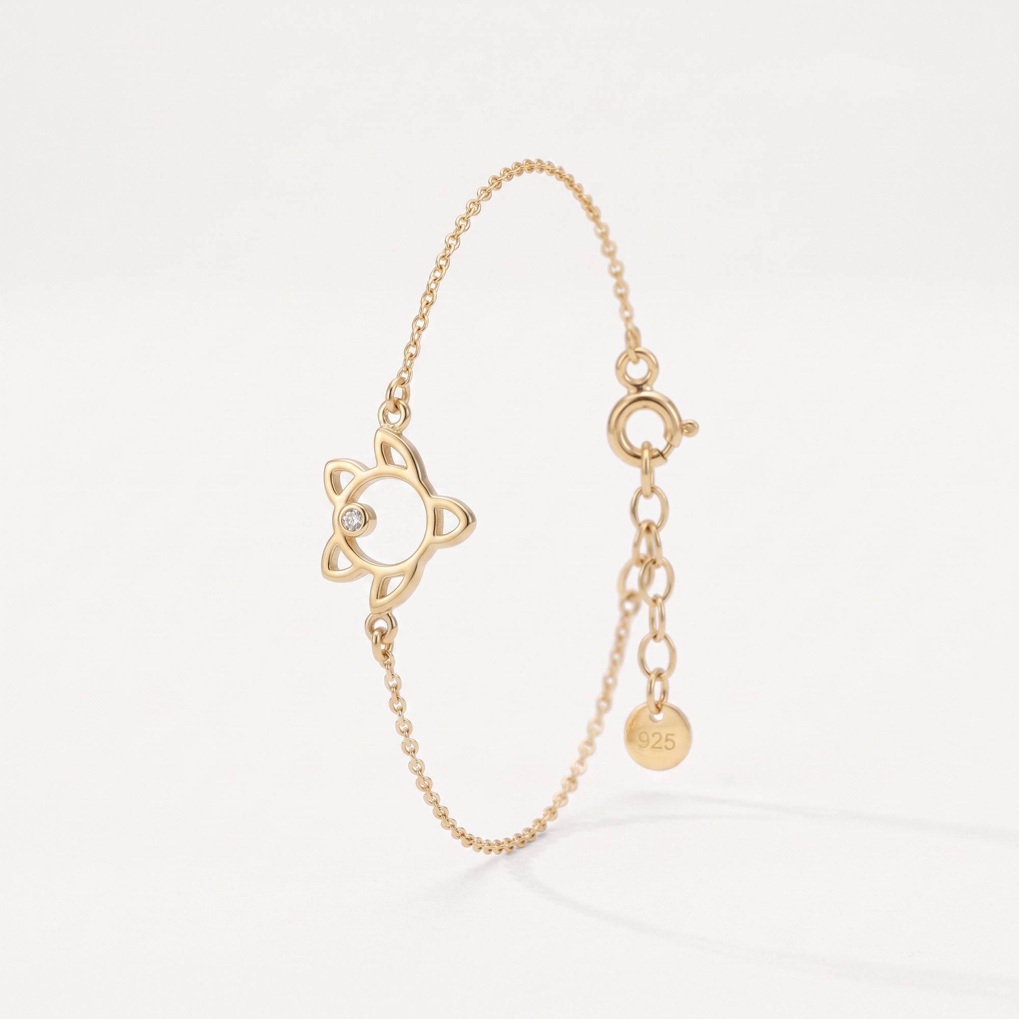 Gold sea turtle bracelet in 18K gold vermeil, an open turtle outline with a single clear stone on a dainty cable chain