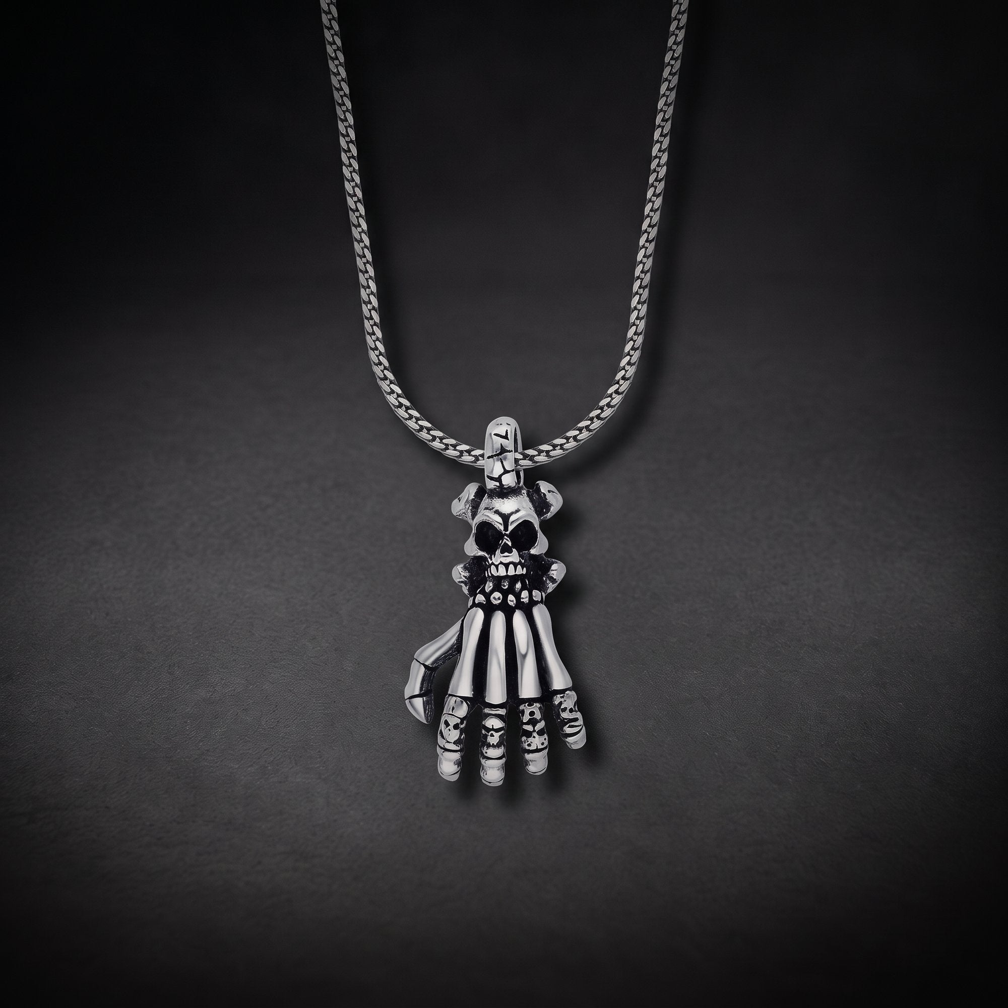 Men's skeleton hand necklace with a skull in 925 sterling silver