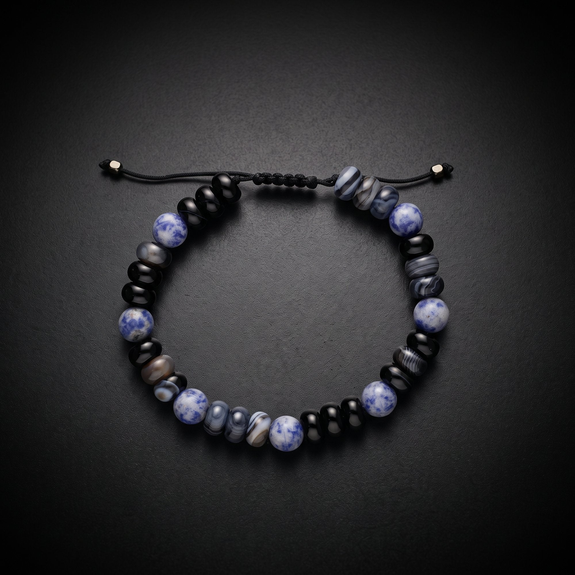 Men's sodalite and black onyx natural stone bracelet on an adjustable cord