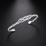 Men's twisted wire cuff bracelet in sterling silver with a knot design