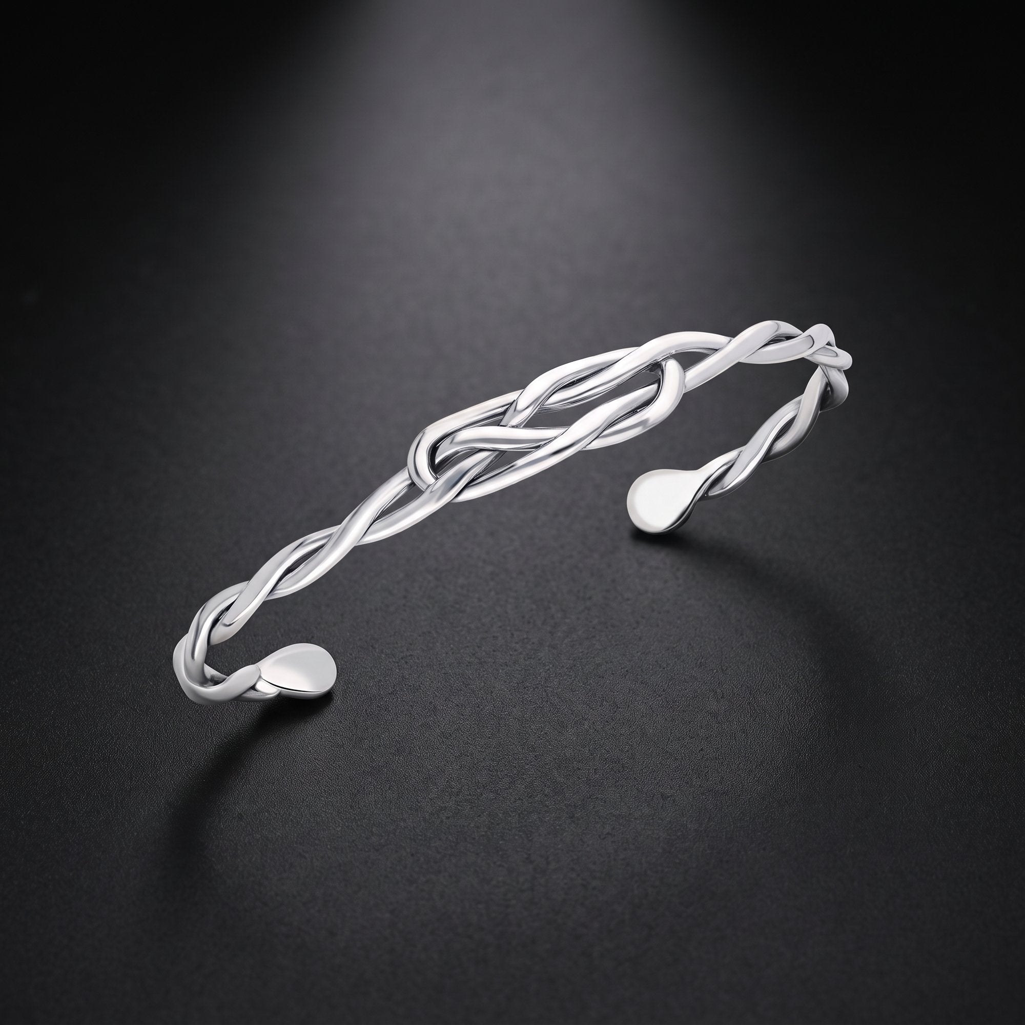 Men's twisted wire cuff bracelet in sterling silver with a knot design