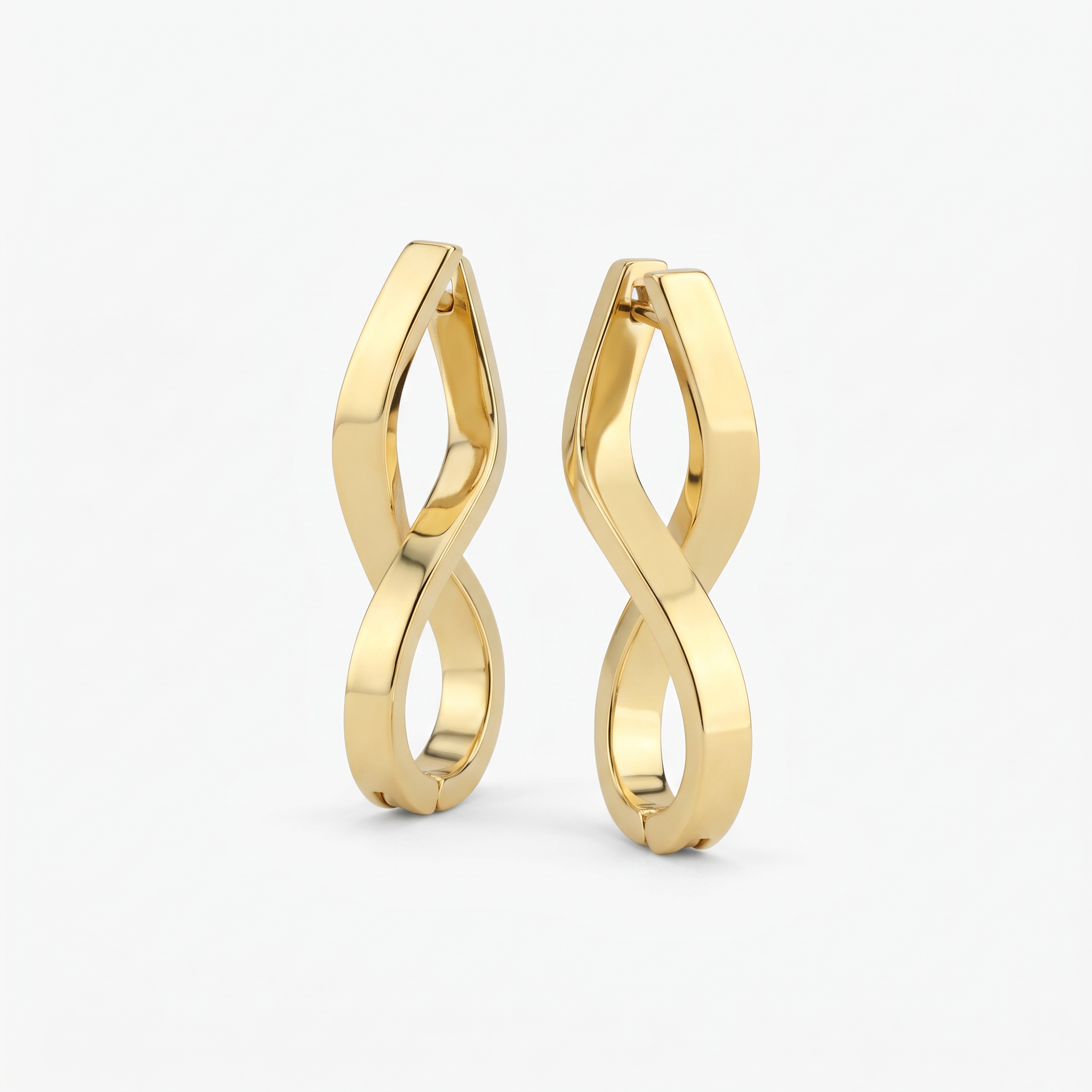 Gold infinity hoop earrings in 18K gold vermeil, a pair of twisted figure-eight hoops with hinged clasp